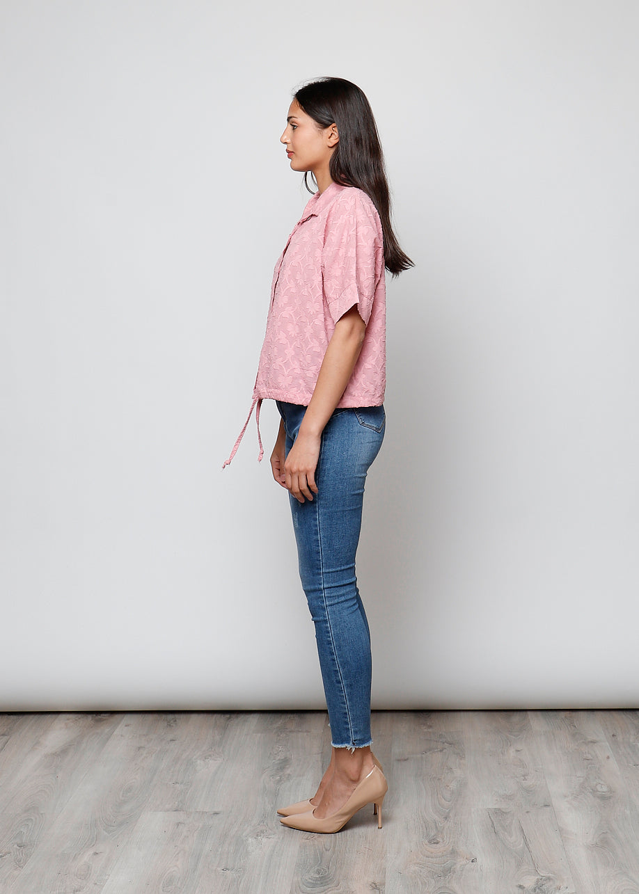 Blusa aperta con bottini