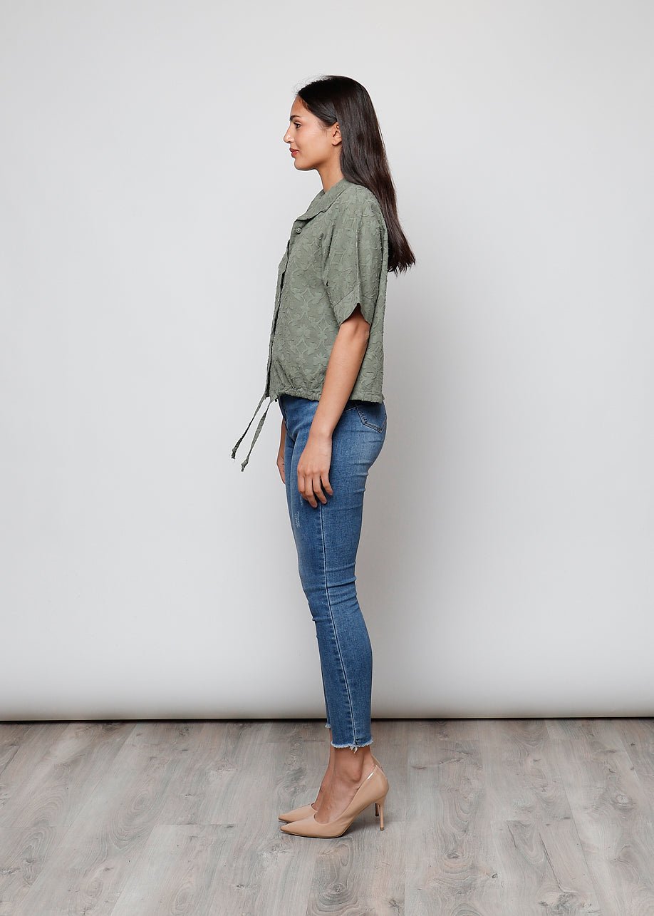 Blusa aperta con bottini