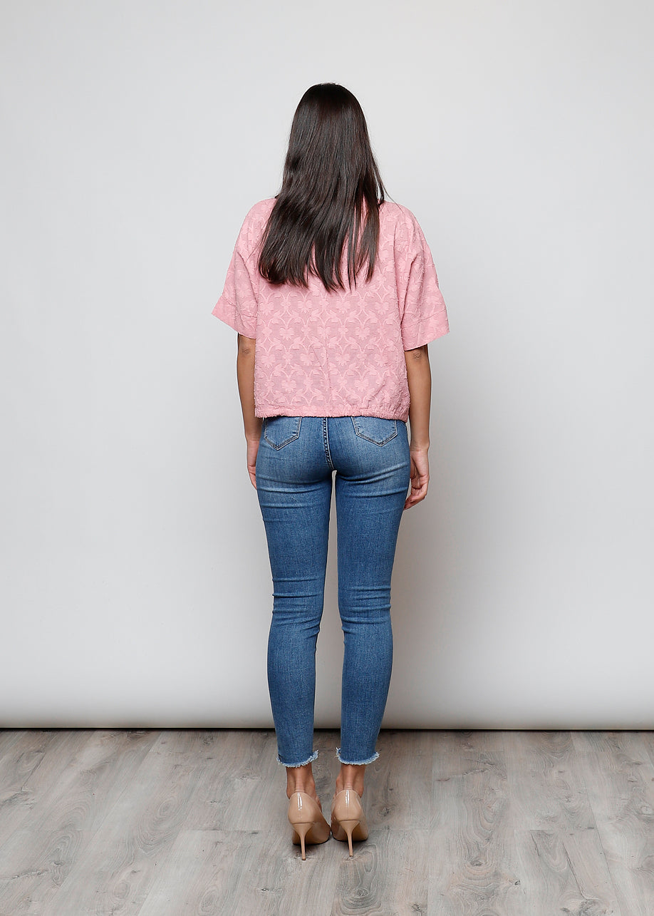 Blusa aperta con bottini