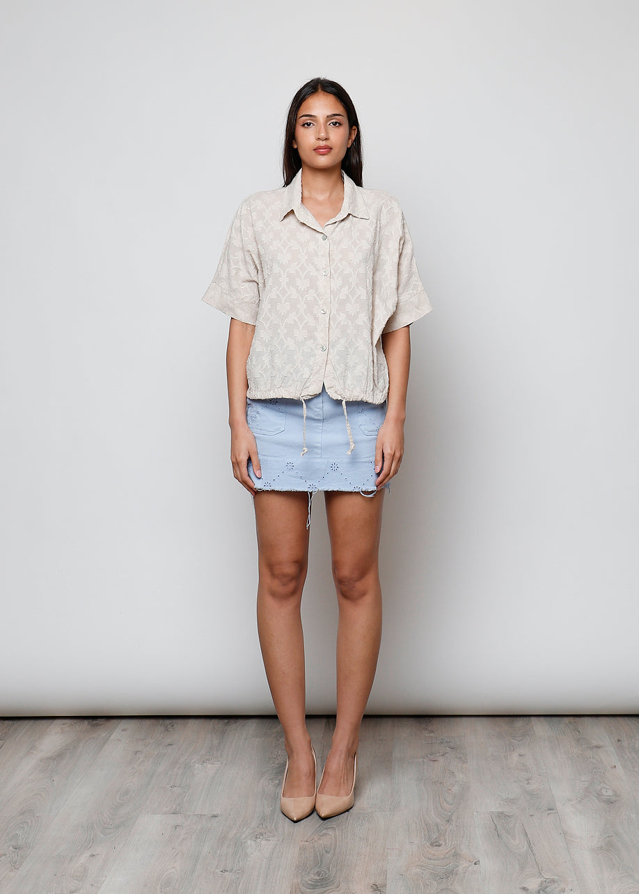 Blusa aperta con bottini