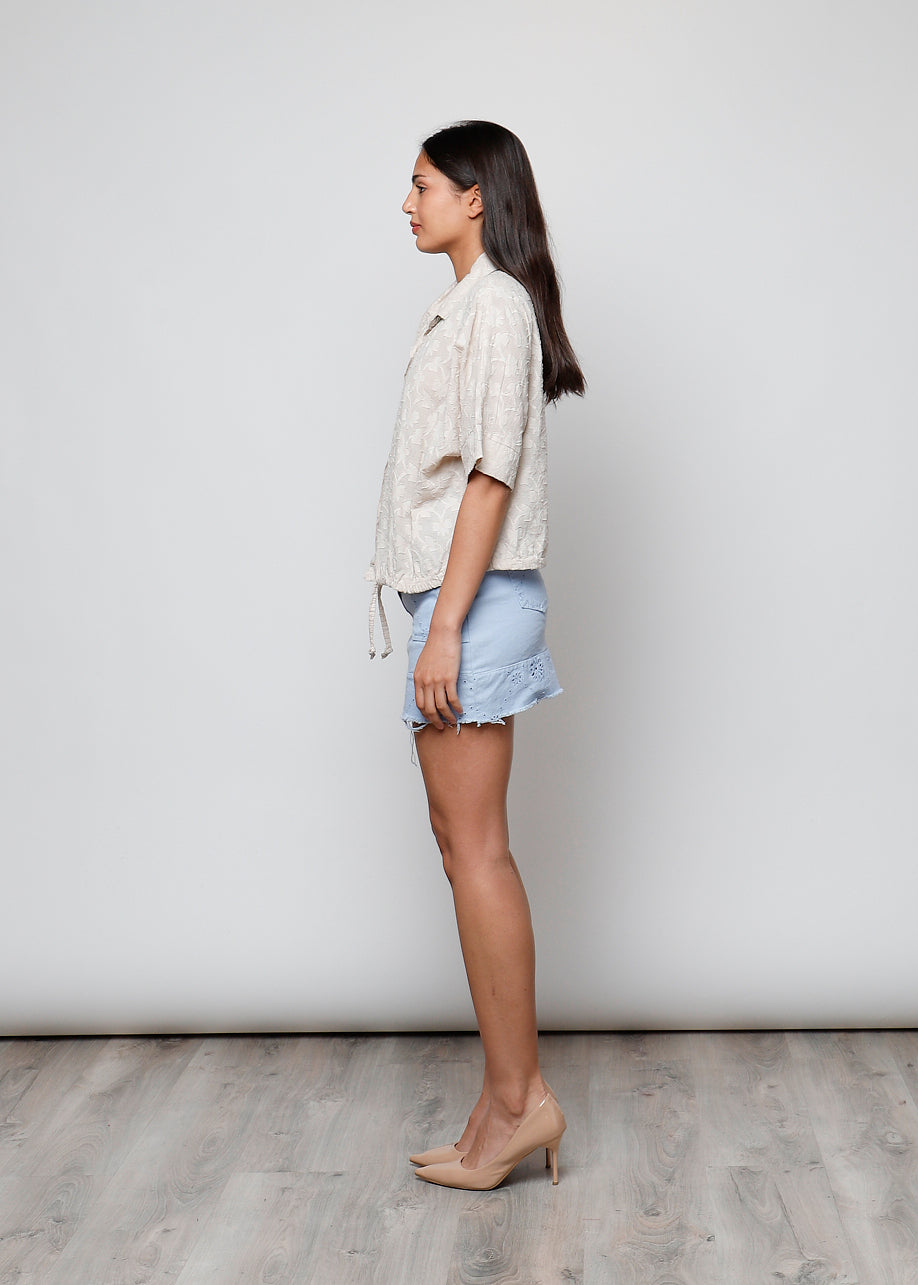 Blusa aperta con bottini