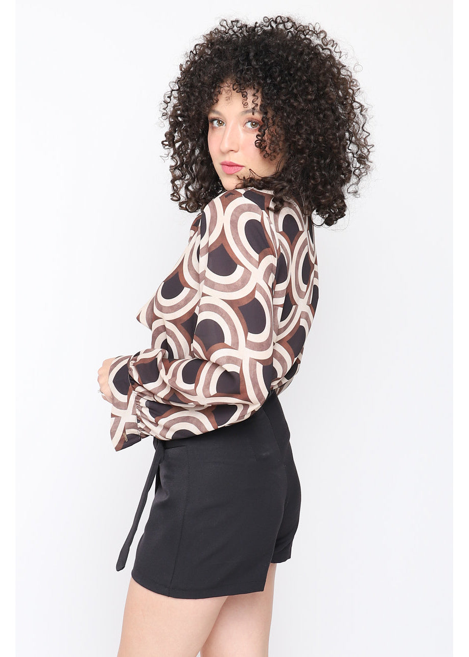Blusa con fiocco stampa geometrica