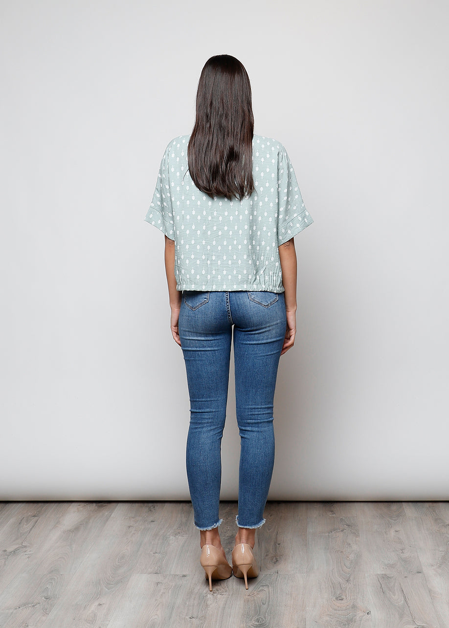 Blusa aperta con bottoni