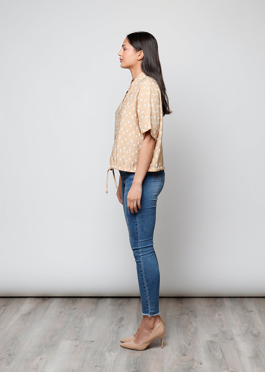 Blusa aperta con bottoni