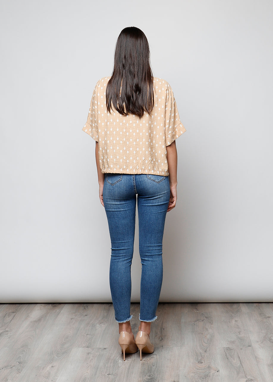 Blusa aperta con bottoni