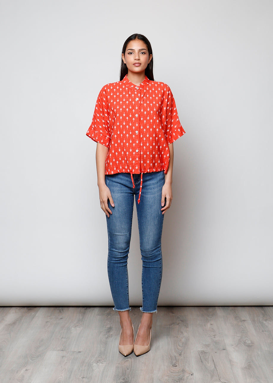 Blusa aperta con bottoni