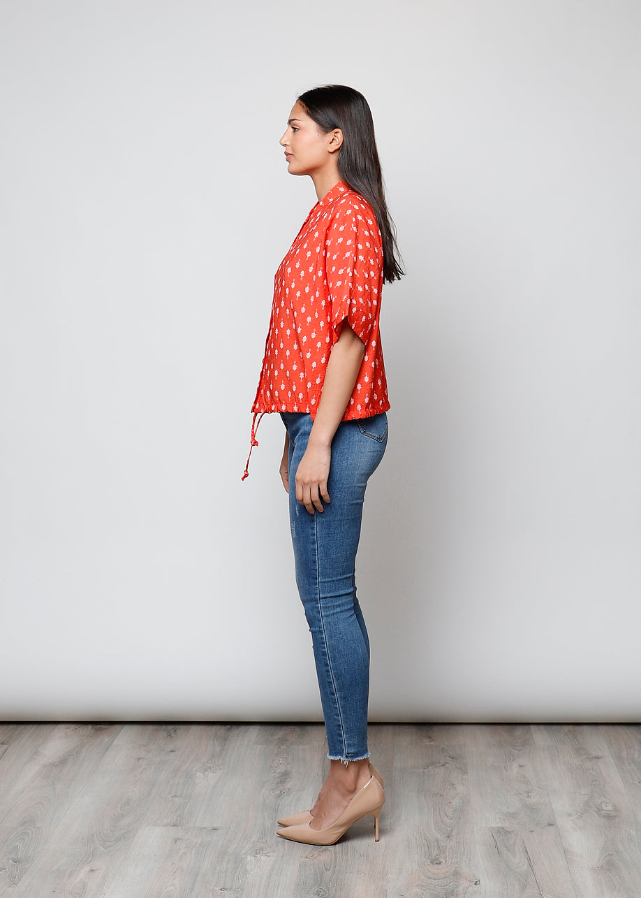 Blusa aperta con bottoni