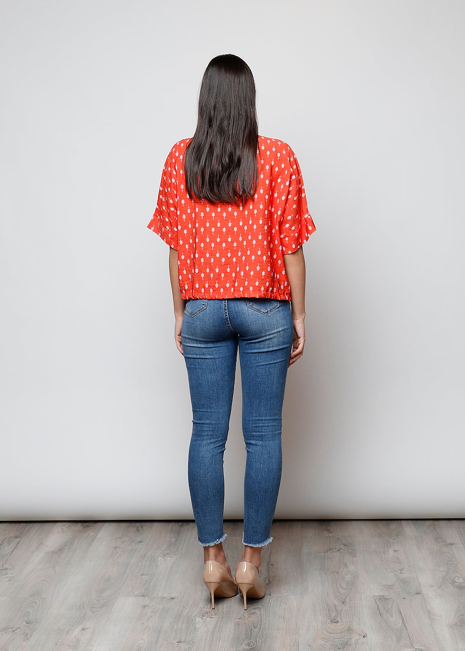 Blusa aperta con bottoni