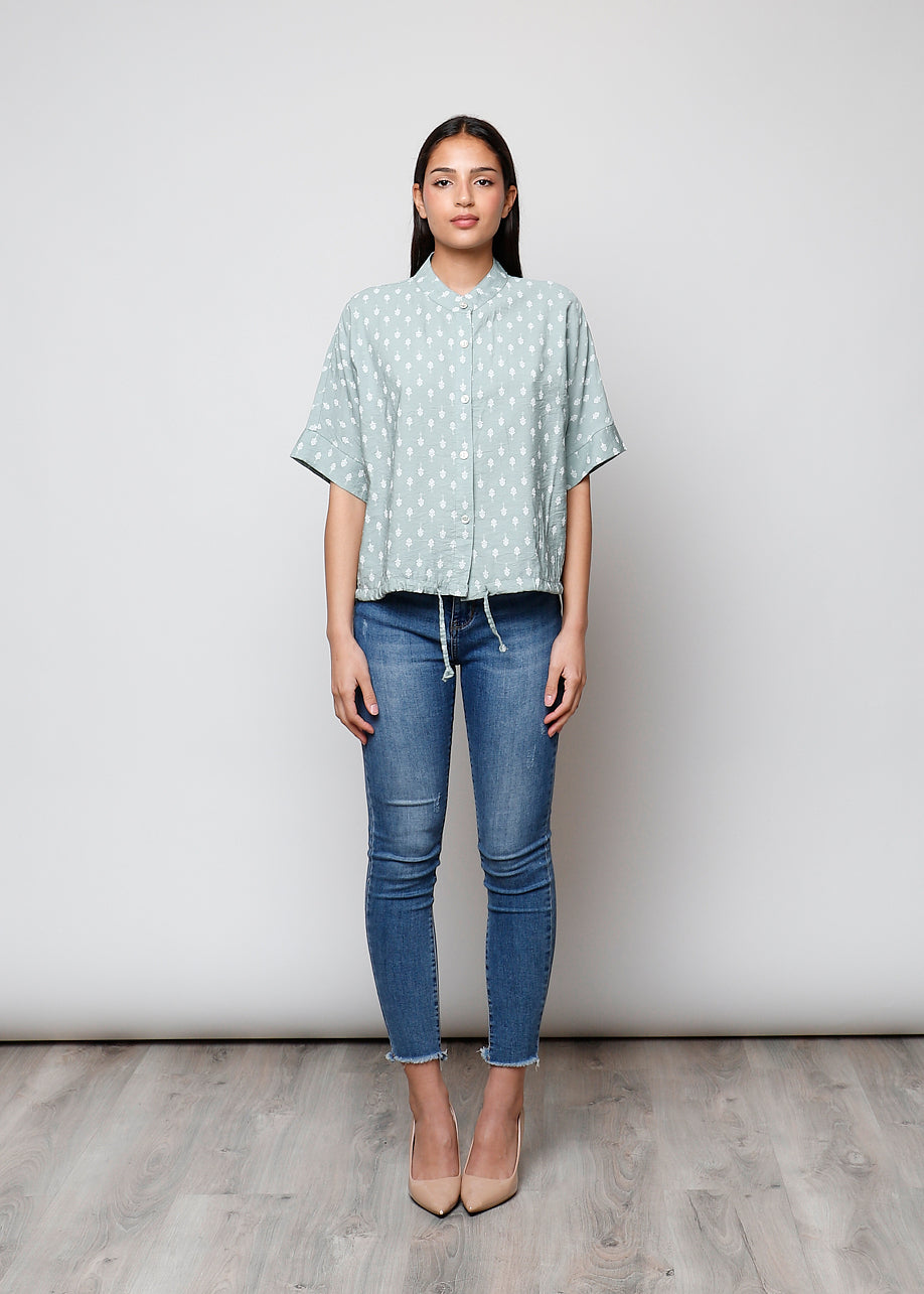 Blusa aperta con bottoni
