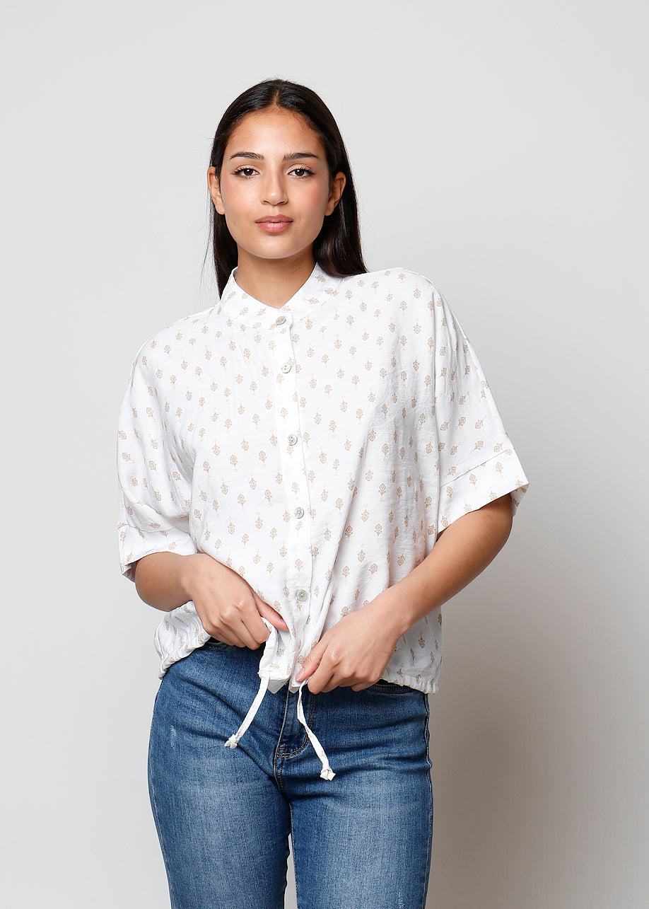 Blusa aperta con bottoni