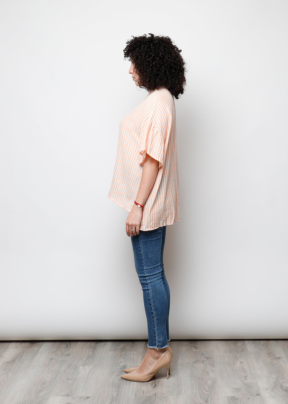 Blusa aperta con bottini rigata