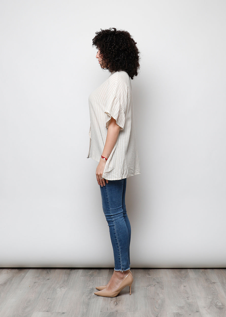 Blusa aperta con bottini rigata
