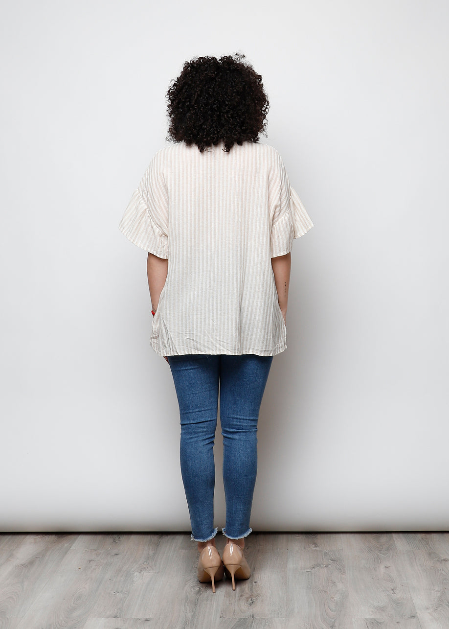 Blusa aperta con bottini rigata