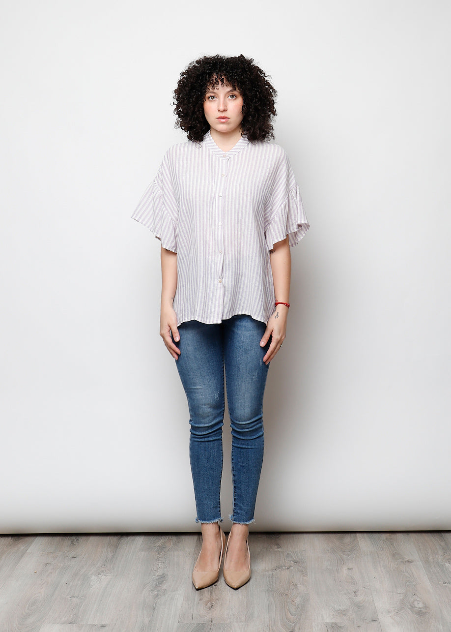 Blusa aperta con bottini rigata