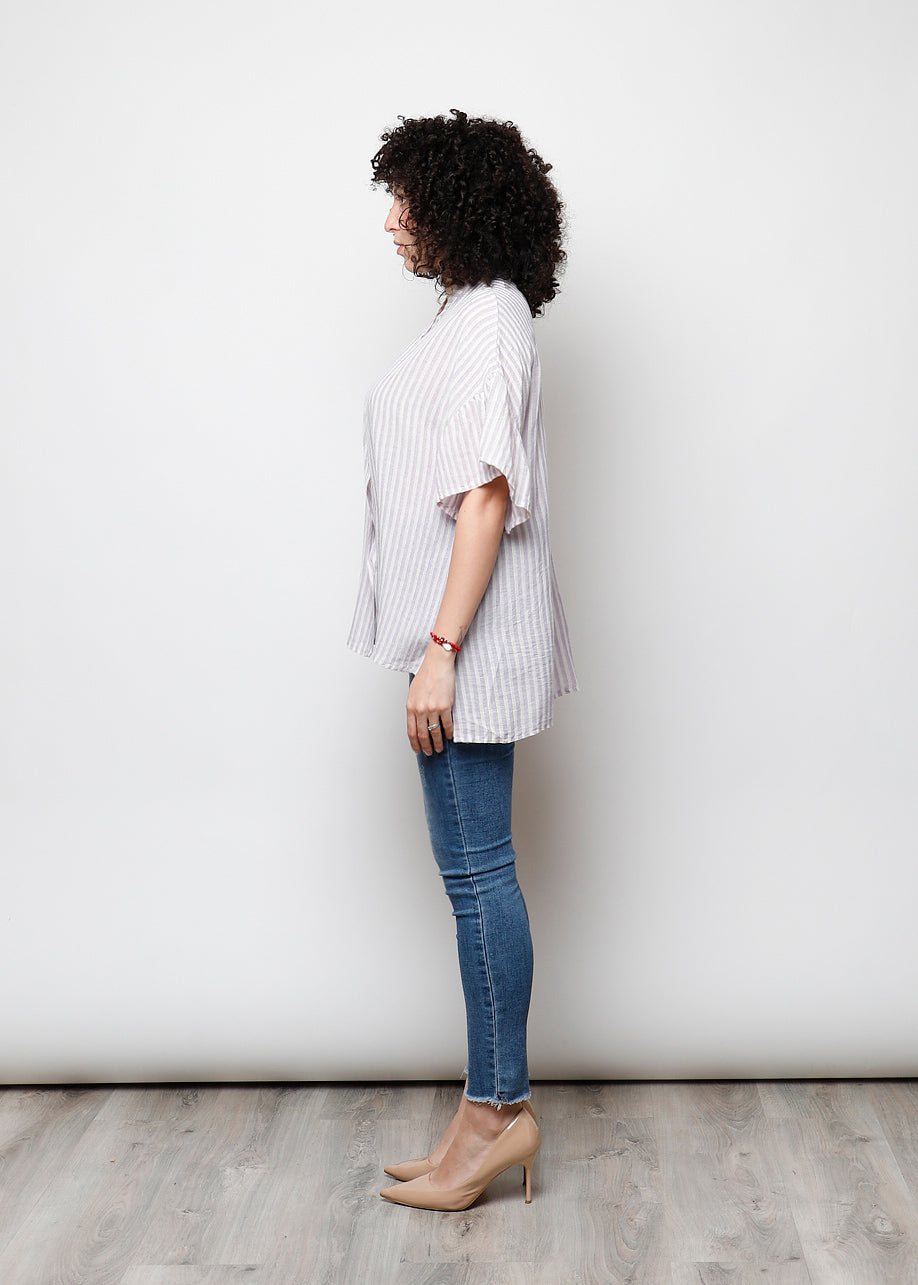 Blusa aperta con bottini rigata