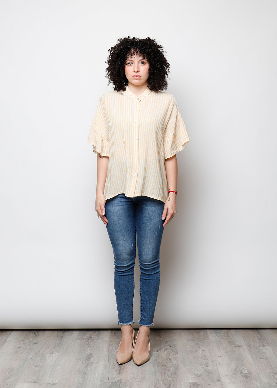 Blusa aperta con bottini rigata