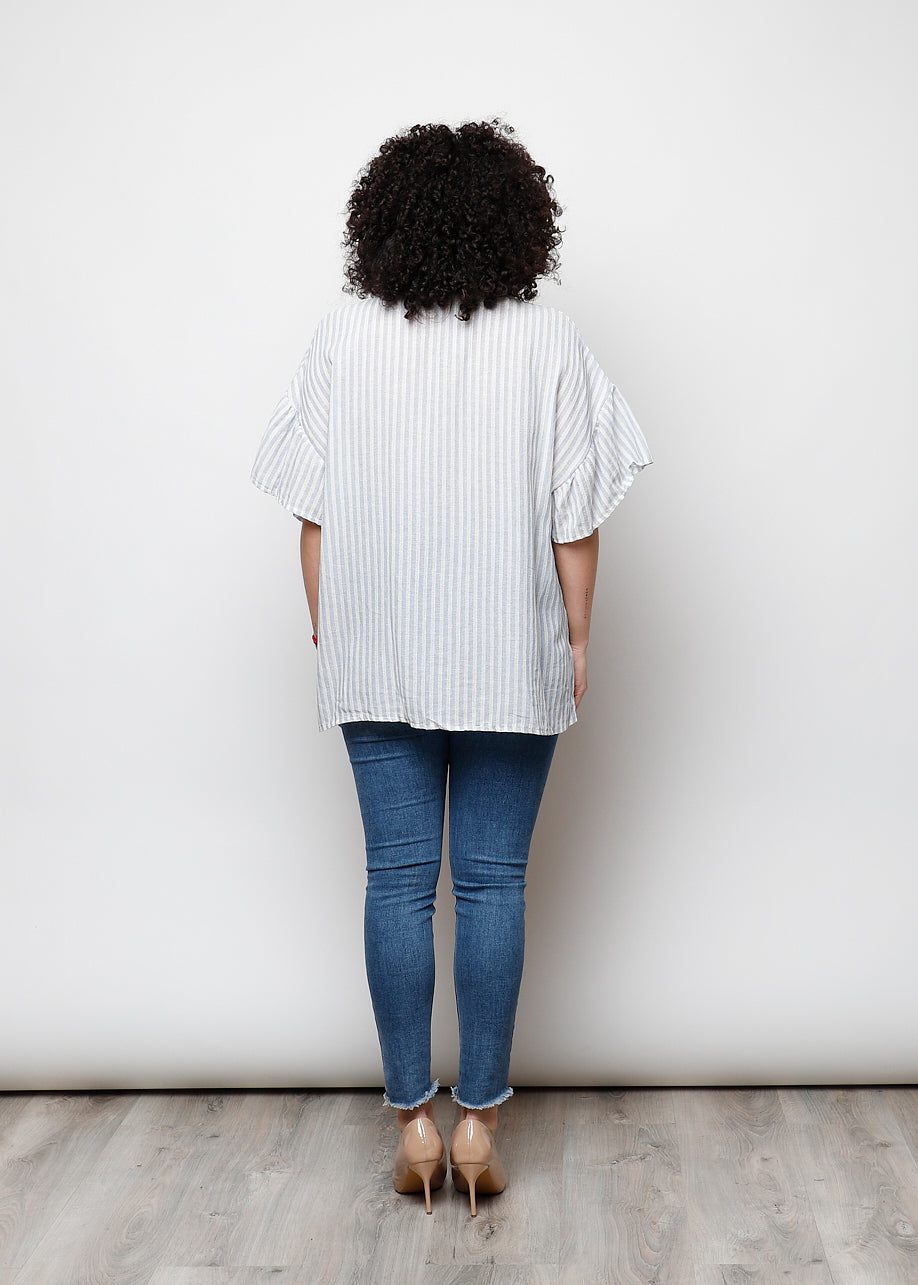 Blusa aperta con bottini rigata