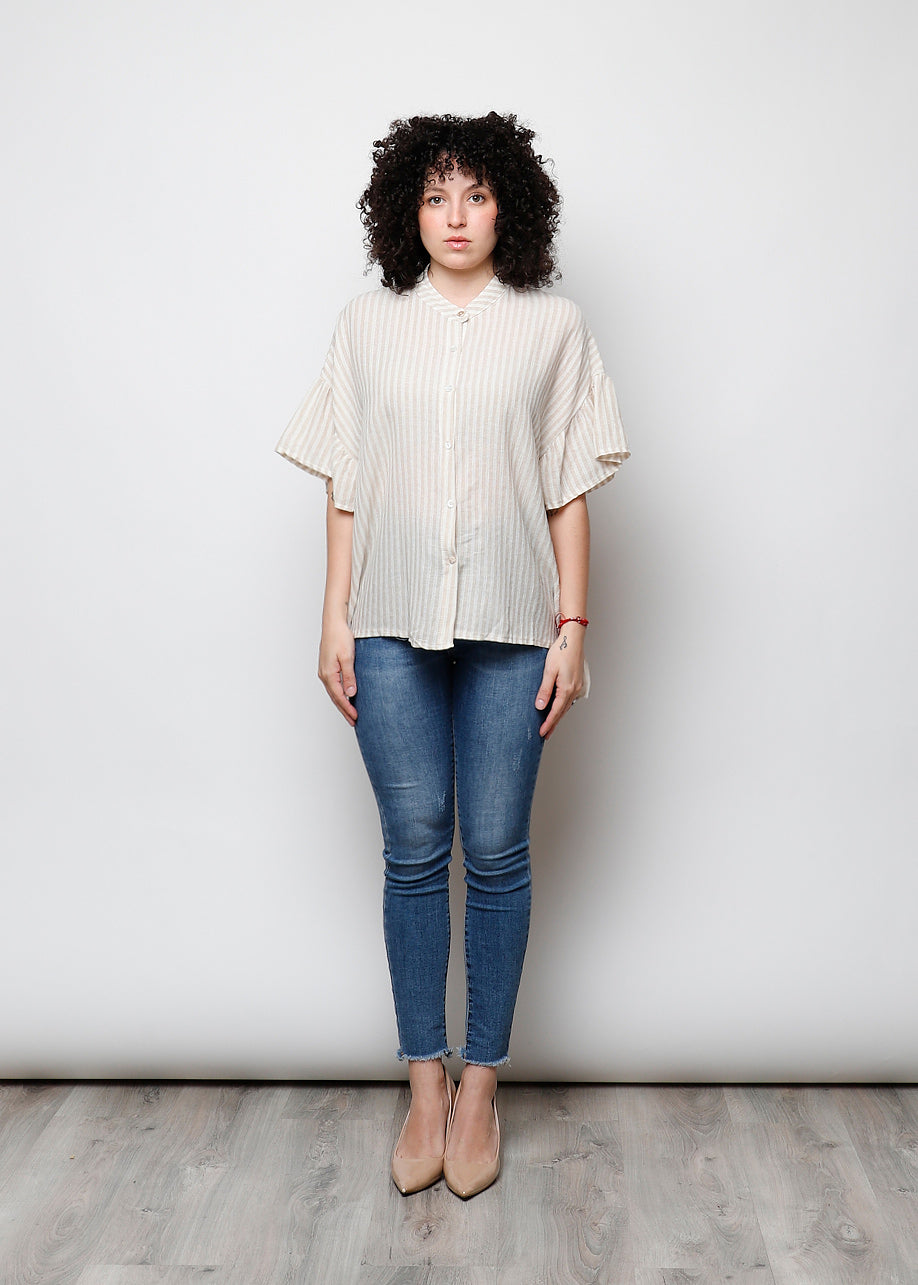 Blusa aperta con bottini rigata