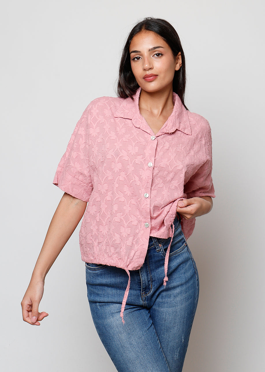 Blusa aperta con bottini