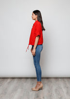 Blusa aperta con bottini