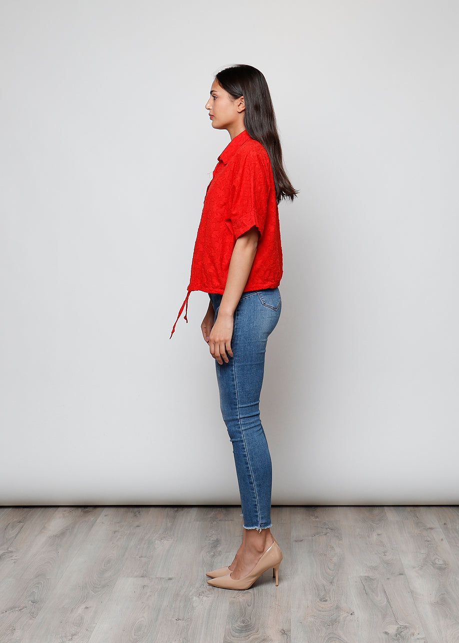 Blusa aperta con bottini