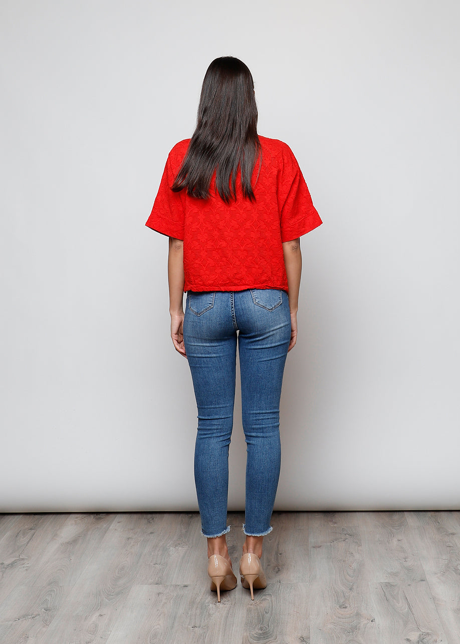 Blusa aperta con bottini