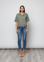 Blusa aperta con bottini
