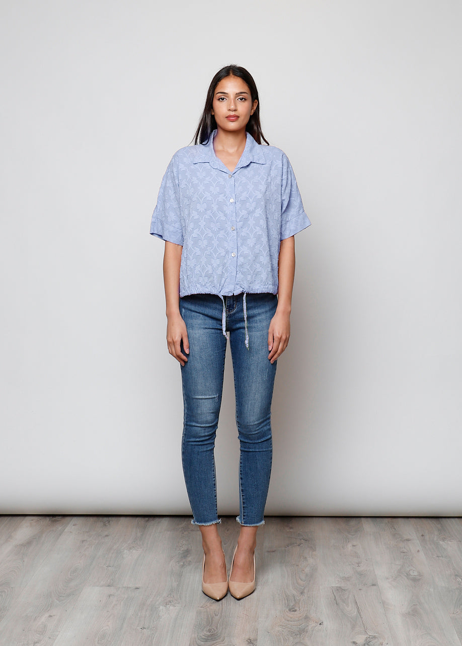 Blusa aperta con bottini