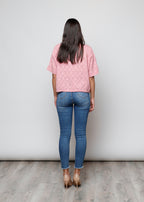 Blusa aperta con bottini