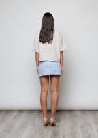 Blusa aperta con bottini