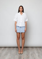 Blusa aperta con bottini