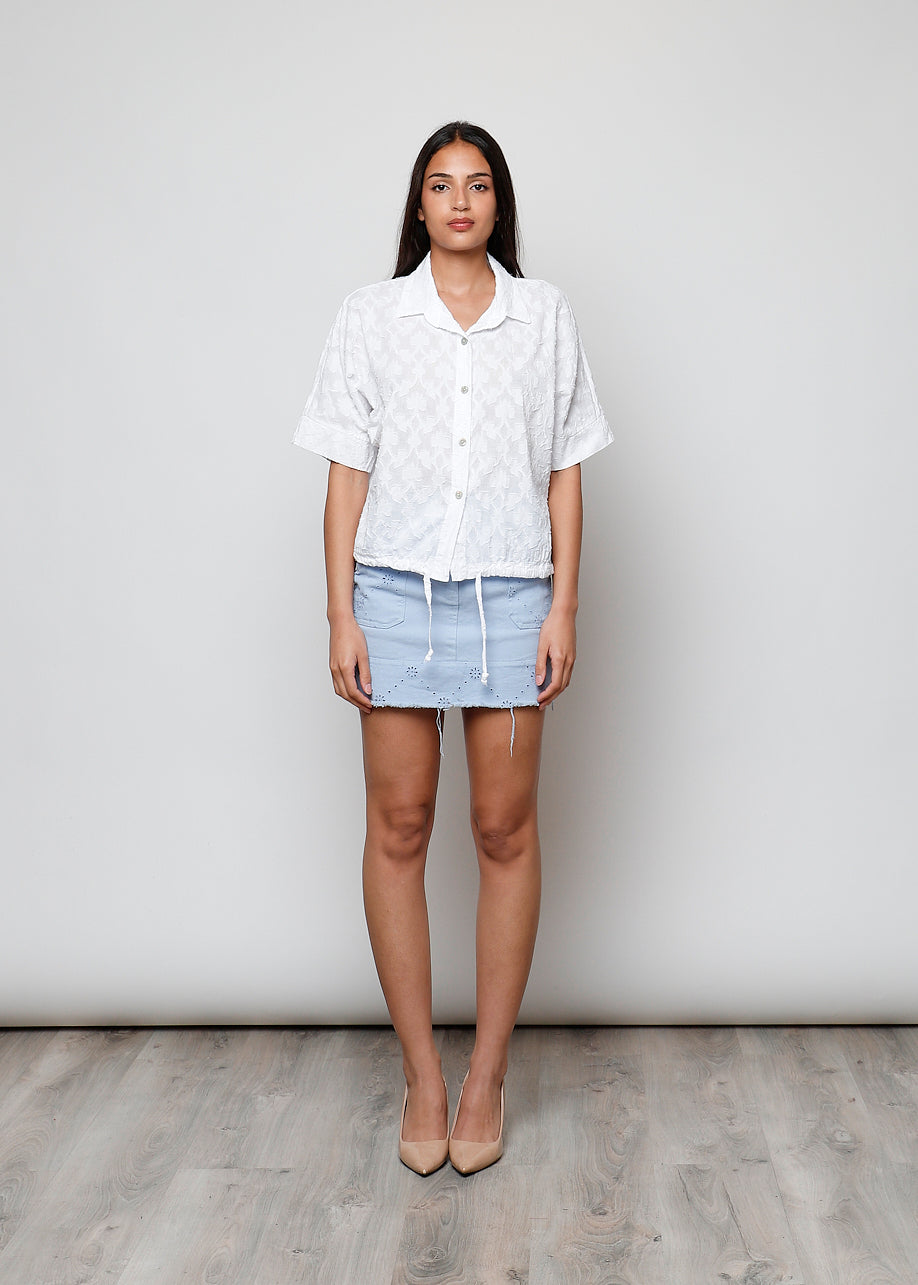Blusa aperta con bottini