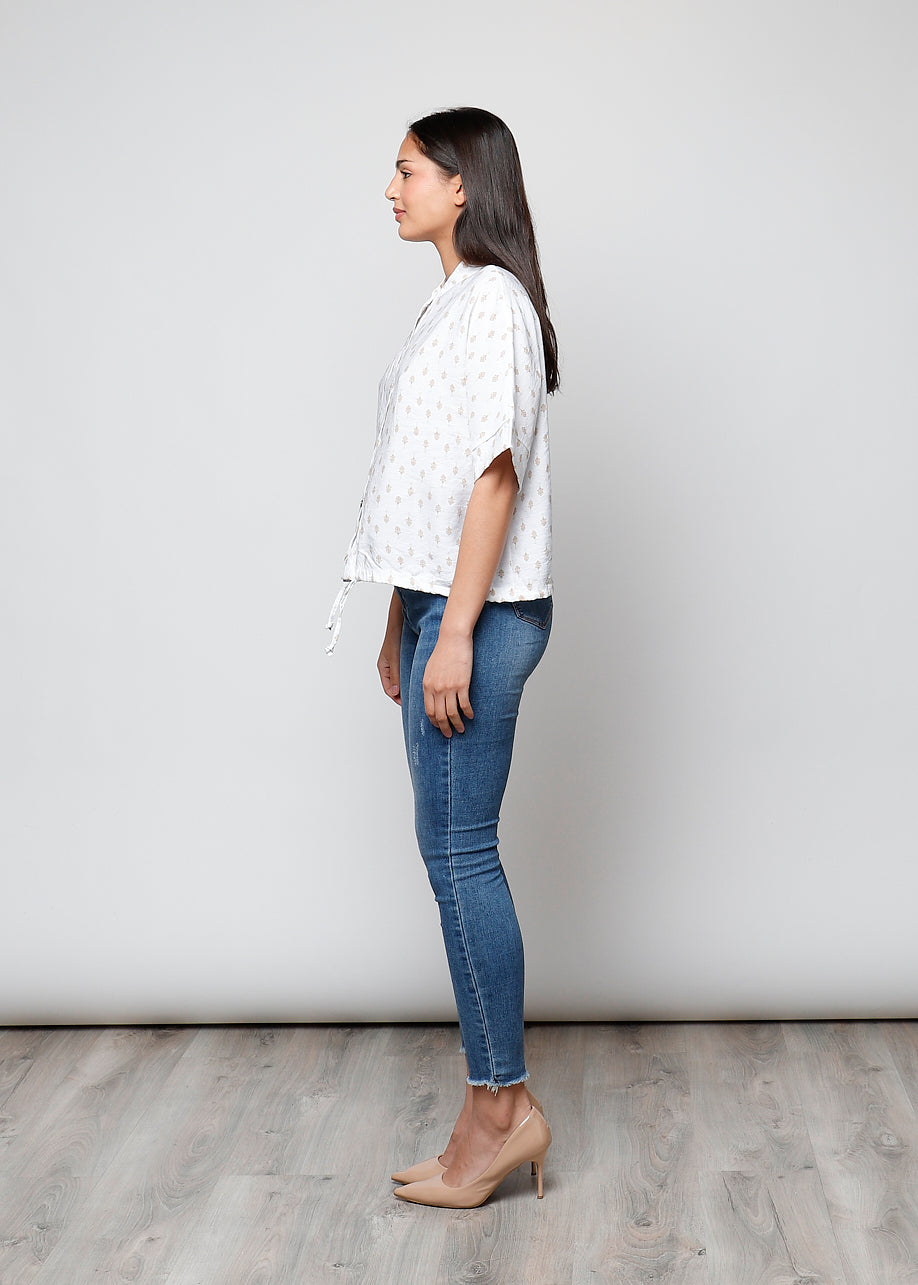 Blusa aperta con bottoni