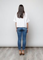 Blusa aperta con bottoni