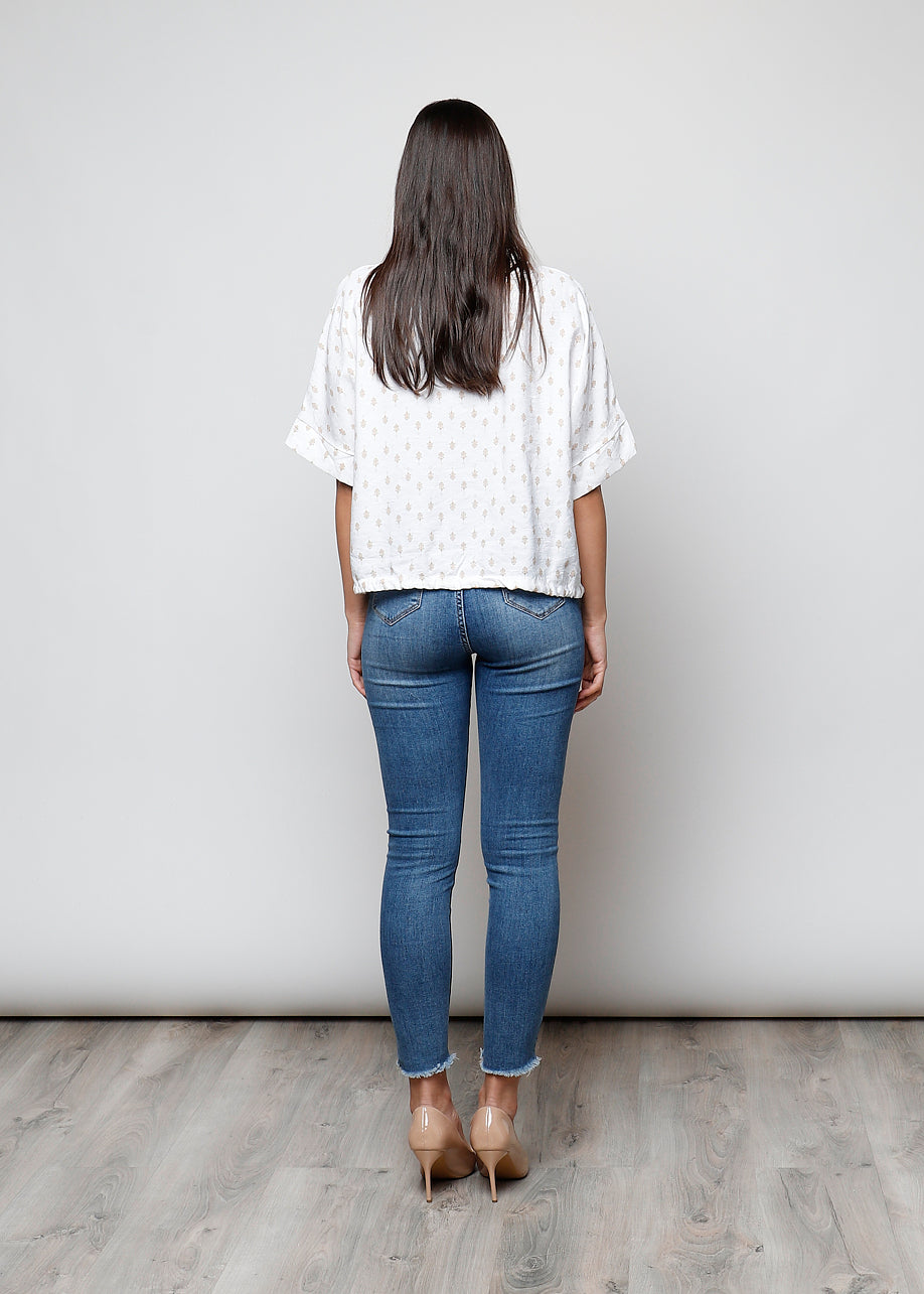 Blusa aperta con bottoni