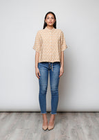 Blusa aperta con bottoni