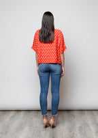 Blusa aperta con bottoni