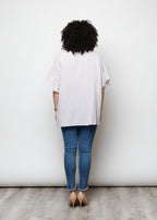 Blusa aperta con bottini rigata
