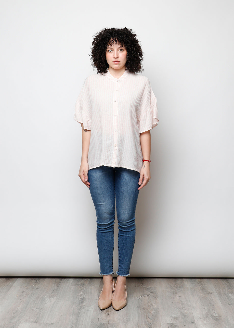 Blusa aperta con bottini rigata