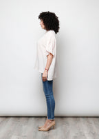 Blusa aperta con bottini rigata