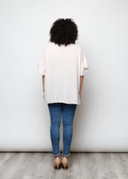 Blusa aperta con bottini rigata