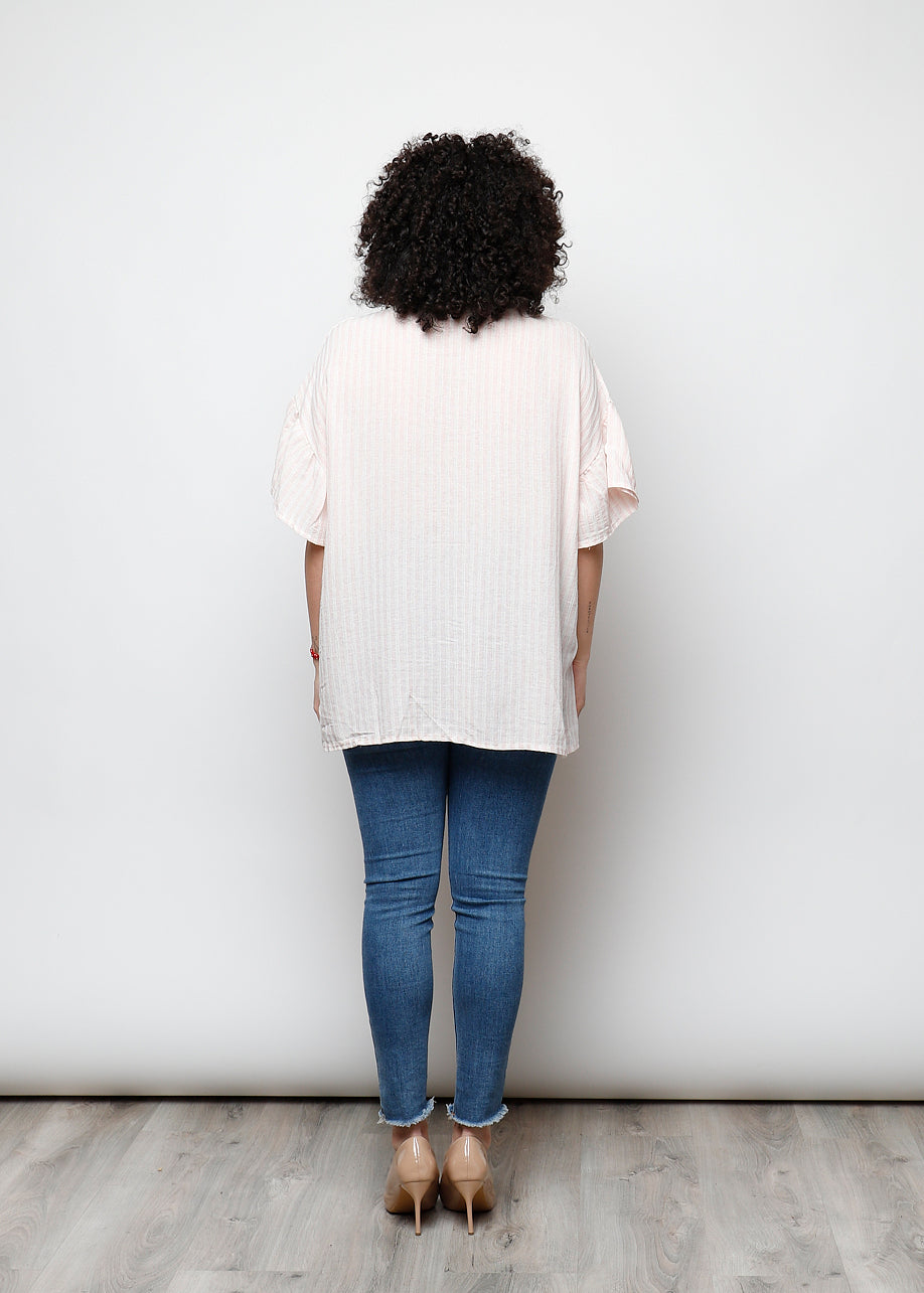 Blusa aperta con bottini rigata