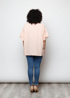 Blusa aperta con bottini rigata
