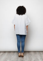 Blusa aperta con bottini rigata