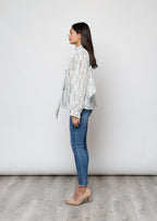Camicia con fiocco, a manica lunga, stampa floreale con filo lurex.