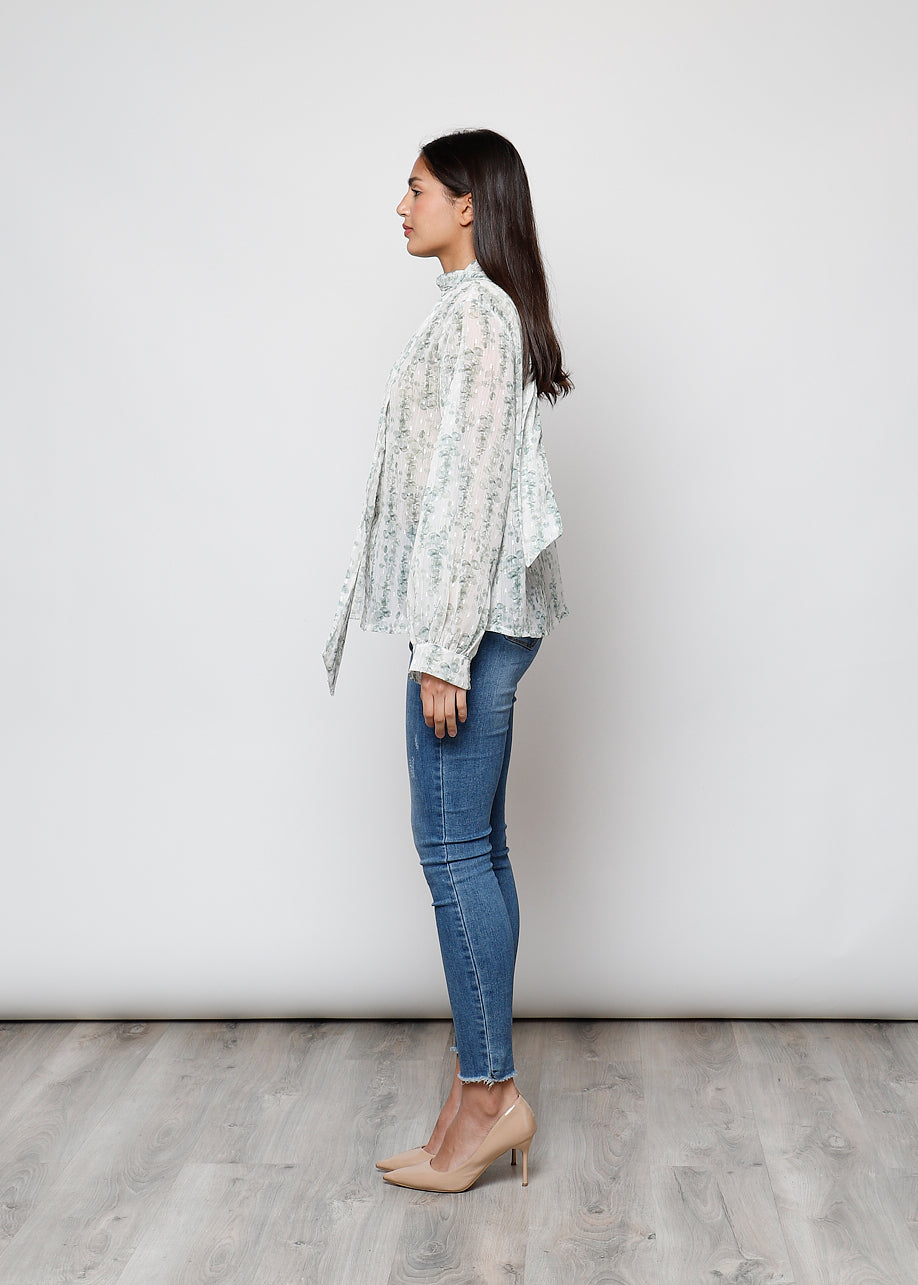 Camicia con fiocco, a manica lunga, stampa floreale con filo lurex.