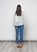 Camicia con fiocco, a manica lunga, stampa floreale con filo lurex.