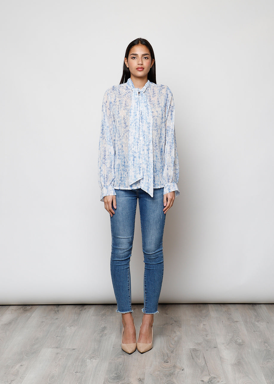 Camicia con fiocco, a manica lunga, stampa floreale con filo lurex.
