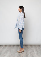 Camicia con fiocco, a manica lunga, stampa floreale con filo lurex.
