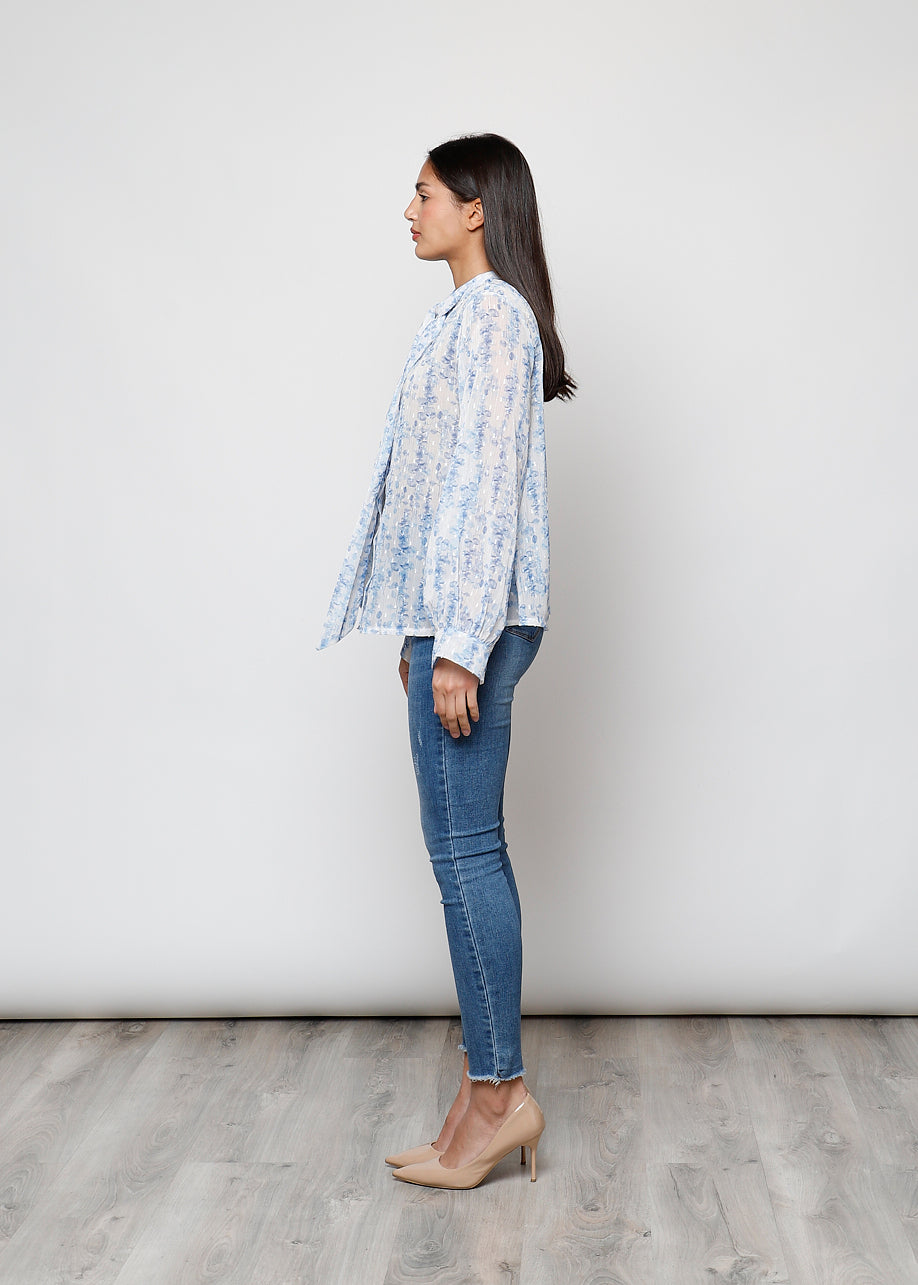 Camicia con fiocco, a manica lunga, stampa floreale con filo lurex.